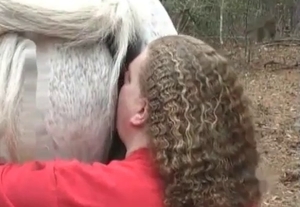 Dude fucking a white horse outdoors